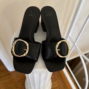 a new day Black Slide Mules with Gold Buckle